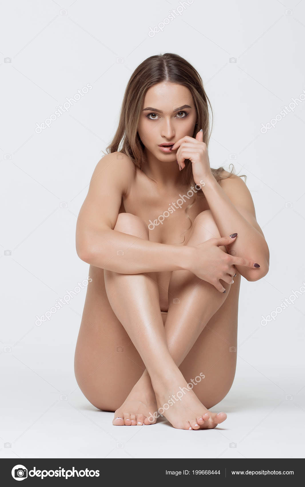 Naked women sitting on camera