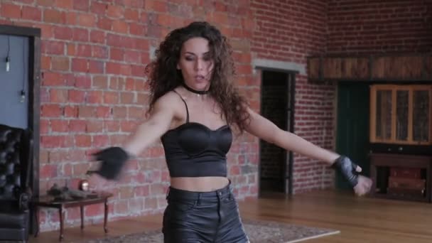 Young lady with curly hair posing in sexy clothes — Stock Video