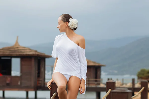Woman in white blouse on resort