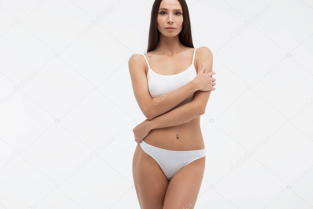 Sensual woman in underwear looking at camera alluringly