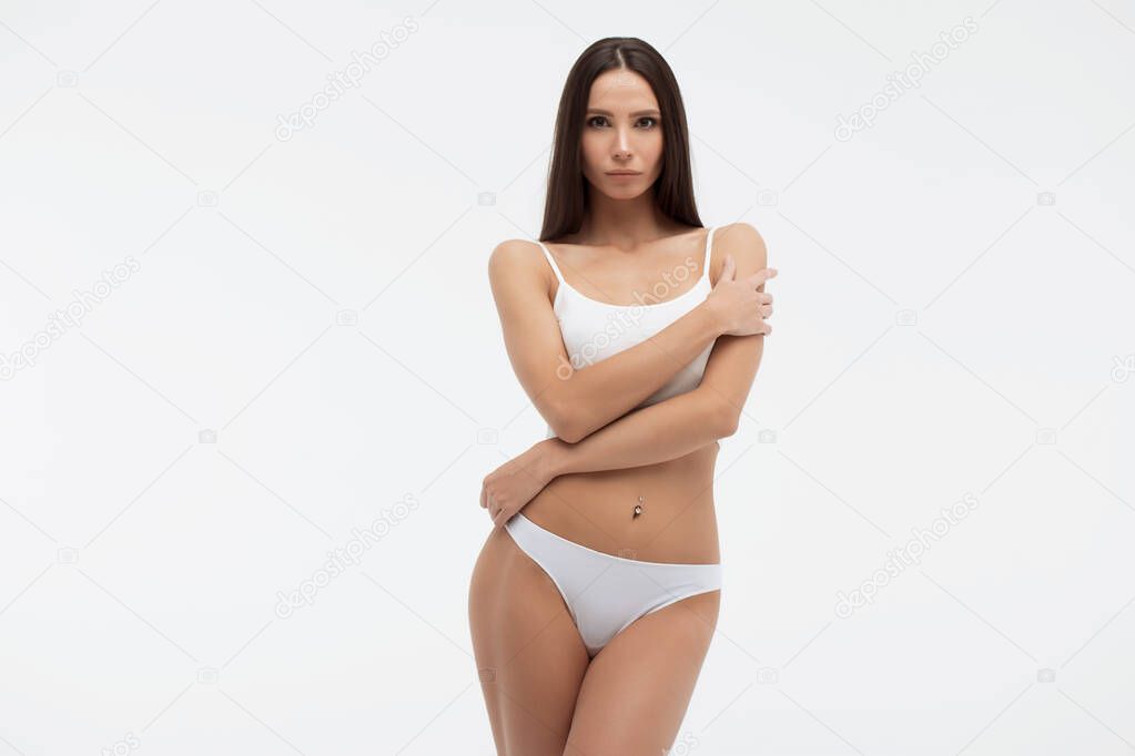Sensual woman in underwear looking at camera alluringly