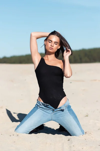Slim Woman Trendy Bodysuit Jeans Touching Body While Resting Beach — Stock Photo, Image
