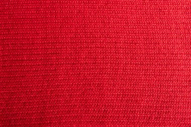 background of a hand-knitted red scarf