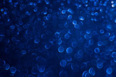 Koyu mavi glitter bokeh ile