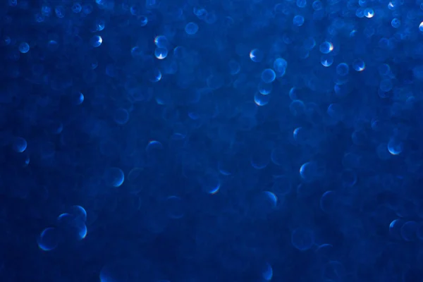 Ciemny niebieski brokat z bokeh — Zdjęcie stockowe