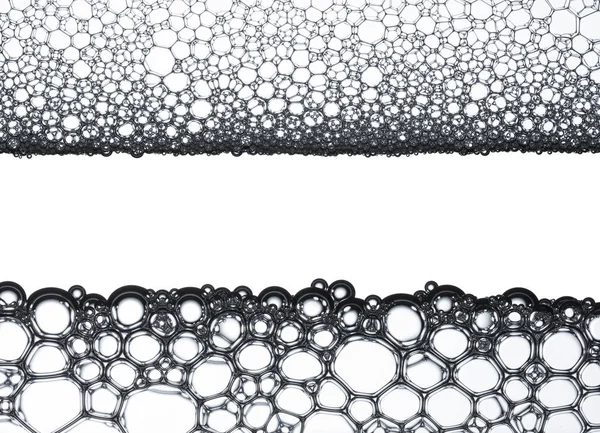 Геометрические клетки, образованные мыльными пузырями и водой, для фона или текстуры — стоковое фото