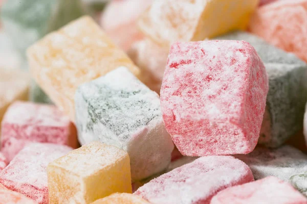Pieces of multicolored Turkish Delight in powdered sugar. — Stock Photo, Image