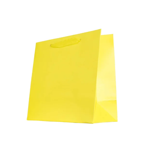 Żółty worek karton z wstążki, zakupy, na białym tle na białym tle. — Zdjęcie stockowe
