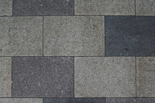 Gray granite. Rectangular pavement slab. Top view.