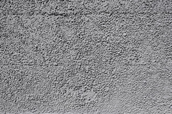 Σαγρέ τσιμεντένιο τοίχο με γκρι, αιχμηρές πέτρες. — Φωτογραφία Αρχείου