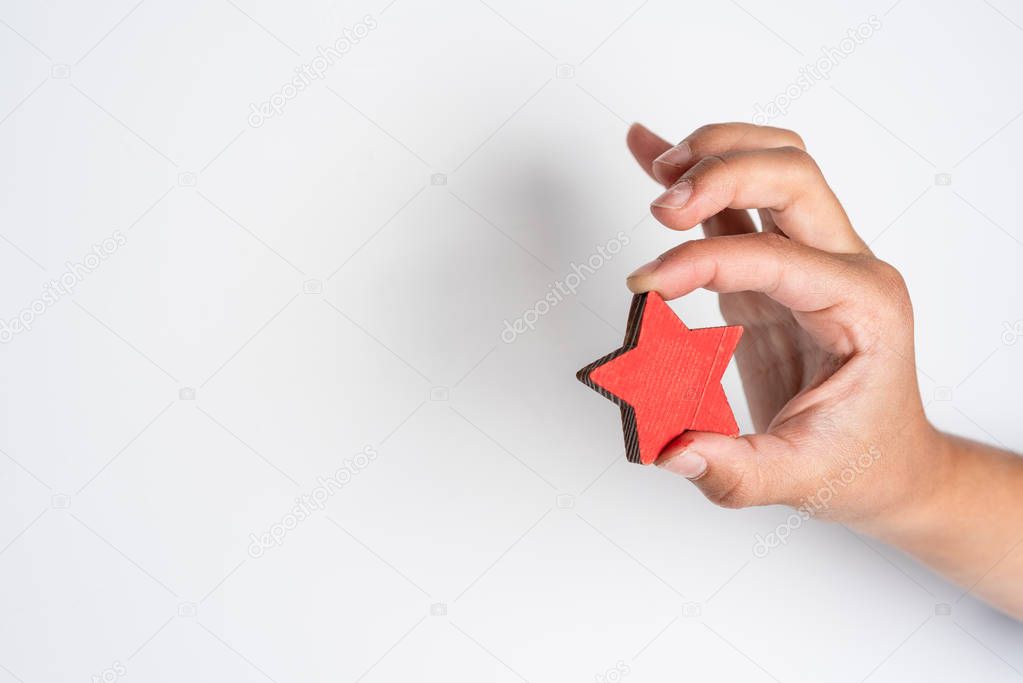 Star rating in the children's hand. Red approval sign on a white background.