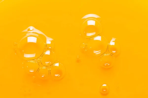 Bąbelki Żółtym Oleju Tekstura Kosmetycznego Szamponu — Zdjęcie stockowe