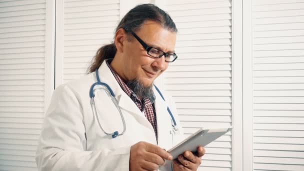 Cheerful Physician Holding Digital Tablet Checking Diagnostics — Stock Video