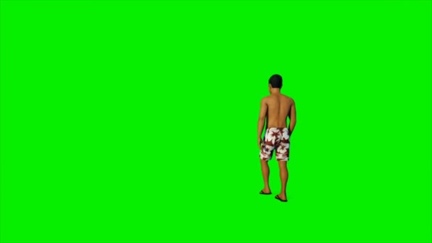 Kaukasischer Mann in kurzen Hosen läuft gegen grünen Schirm — Stockvideo