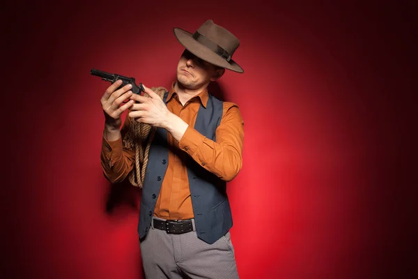 cowboy with a pistol, a gold miner adventure guy in a hat with a gun