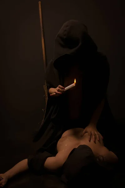 halloween coven witch, hot wax dripping onto the chest
