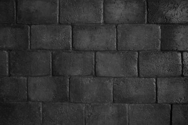 Tuğla siyah duvar. Eski bir tuğla evin arka planı.                               