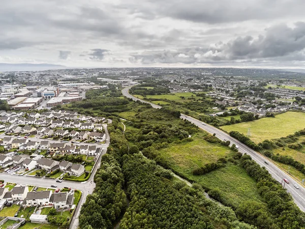 Aerial view, Cloudy sky over Galway city. N6 road and Terryland forest park. Ireland.
