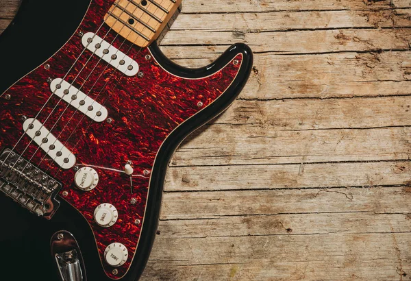 Nahaufnahme Einer Gitarre Auf Vintage Holz Hintergrund Liegend Mit Kopierraum — Stockfoto