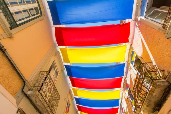 Colorful awning on the street in summer. Outdoor view of the typical architecture of the city of Loule, Portugal.