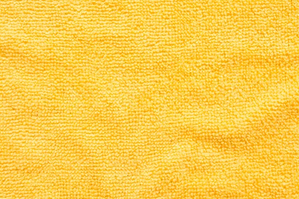 Superficie de tela de microfibra amarilla, patrón macro textil backgr — Foto de Stock