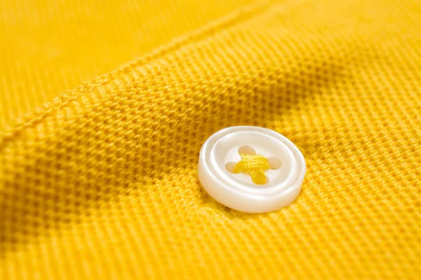 Gele poloshirt textuur, katoenen stof. Textiel achtergrond — Stockfoto