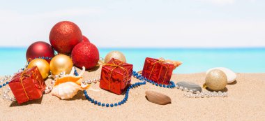 Christmas tree decorations on the beach in tropical sea. Concept