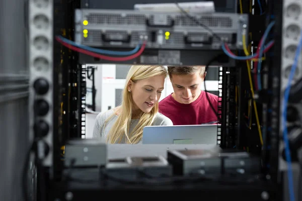 Two IT Engineers in Data Center, Server Room