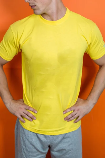 man wearing yellow t-shirt, clothing design concept
