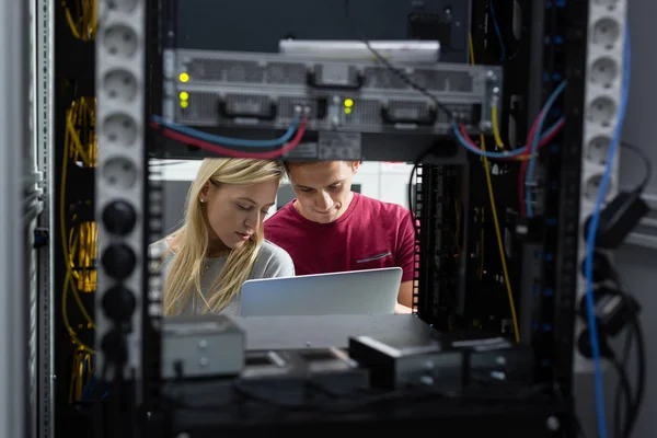 Two IT Engineers in Data Center, Server Room