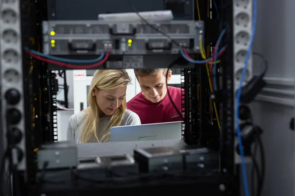 Two IT Engineers in Data Center, Server Room