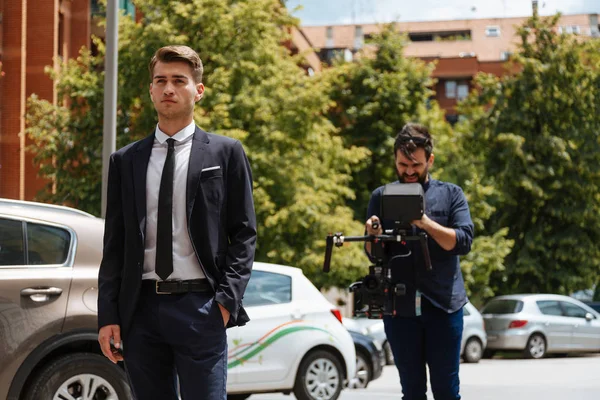 Professional Cameraman Filming Young Businessman — Stock Photo, Image