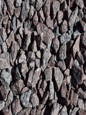 Various-sized gravel rocks, with a textured, crushed appearance.