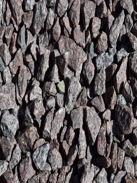 Various-sized gravel rocks, with a textured, crushed appearance.