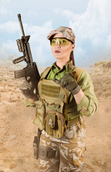 Fully equipped military soldier woman with rifle.