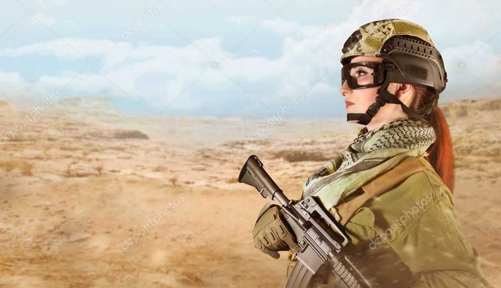 Fully equipped military soldier woman with rifle