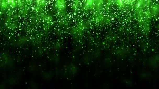 美しいキラキラ明るい背景 緑の落下粒子との背景 休日のデザイン 落下する明るい粒子と魔法の光 シームレスなループ — ストック動画