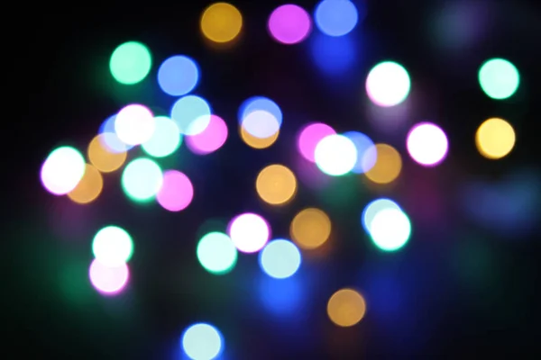 Abstrakte bokeh nigth Hintergrund. bunte magische Lichter Hintergrund, Dekoration für die Party. Neonlichteffekt. blauer Schein — Stockfoto