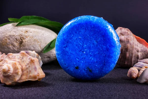 round soap shampoo on the seashells background