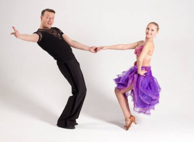 Ballroom dancing Latin Samba, purple dress, black pants clipart