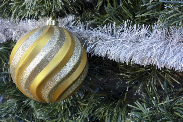 Golden Twisty Christmas Bauble Snow Stripes Fur Tree — Stock Photo, Image