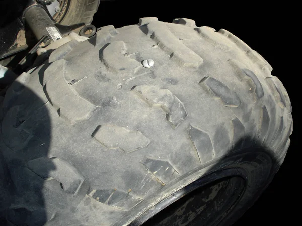 Big Screw used as a Small Puncture Quick Fix on ATV Tire (also known as Red Neck Patch)