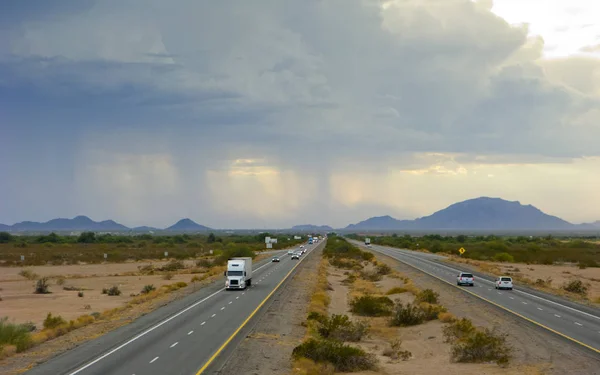 Dangerous dust and rain storm above Interstate-10 in Arizona desert