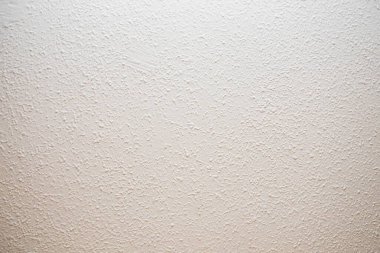 Beyaz desenli duvar yüzeyini kapatın. Tasarım, inşaat, mimari ve iç kavramlar için soyut arkaplan.