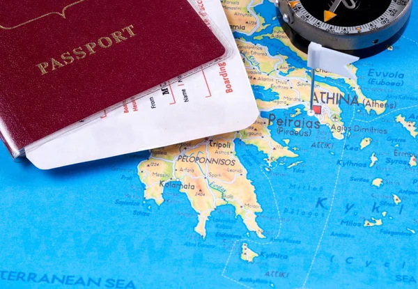 Passport with tickets and compass on a tourist map for travel and recreation — Stock Photo, Image