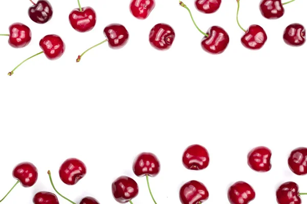 Sweet red cherries isolated on white background with copy space for your text. Top view. Flat lay pattern — Stock Photo, Image