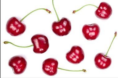 Beyaz arka plan üzerinde izole tatlı kırmızı kiraz. Üstten görünüm. Düz yatıyordu desen