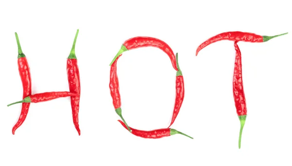 Palabra caliente escrita a partir de letras de pimiento rojo aisladas sobre fondo blanco —  Fotos de Stock