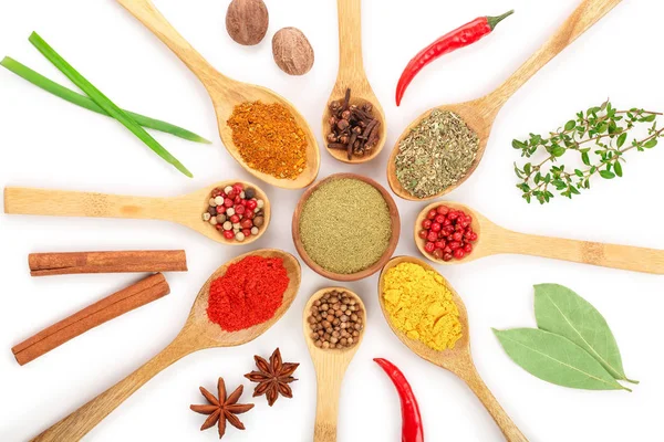 mix of spices in wooden spoon isolated on a white background. Top view. Flat lay. Set or collection