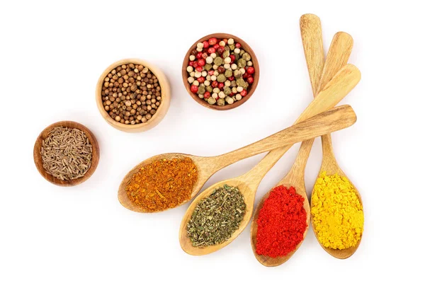 Mix of spices in wooden spoon isolated on a white background. Top view. Flat lay. Set or collection — Stock Photo, Image